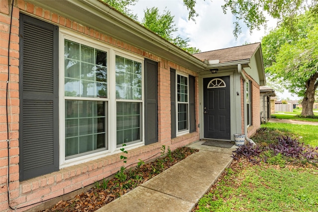 entrance to property with brick siding