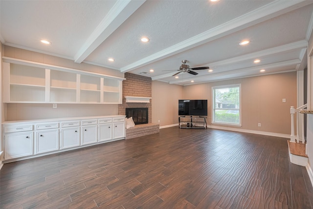 unfurnished living room with dark wood-style flooring, ceiling fan, a fireplace, baseboards, and beamed ceiling