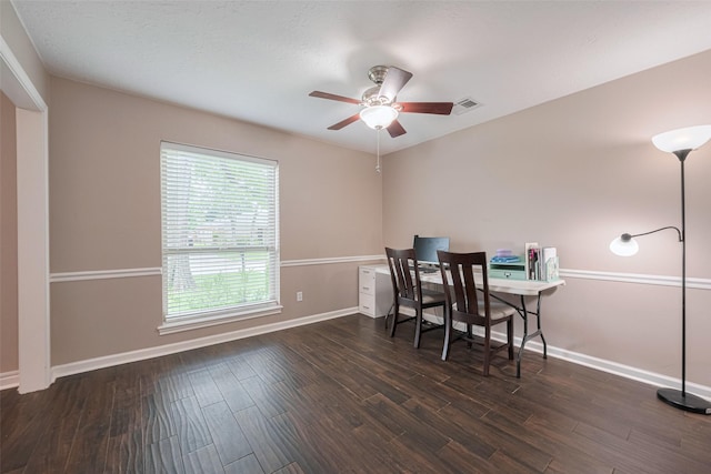 dining area featuring ceiling fan, baseboards, and wood finished floors