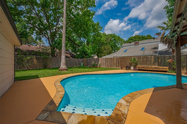 view of pool with a fenced in pool, a fenced backyard, and a patio