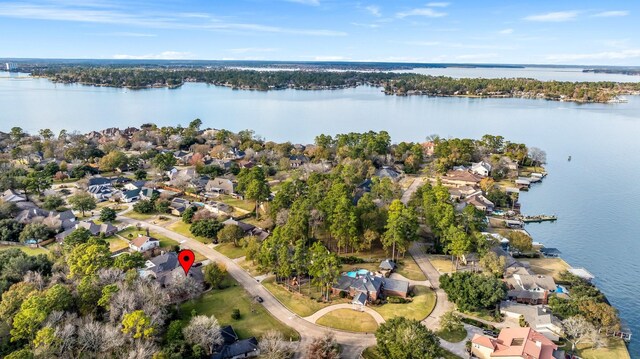 drone / aerial view with a water view and a residential view