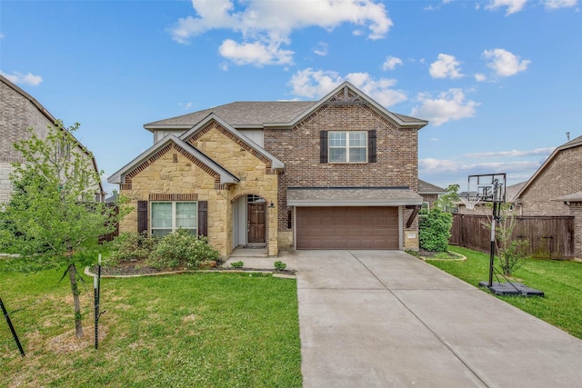 traditional home featuring fence, a front lawn, stone siding, a garage, and driveway