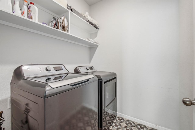 laundry room featuring independent washer and dryer, laundry area, and baseboards