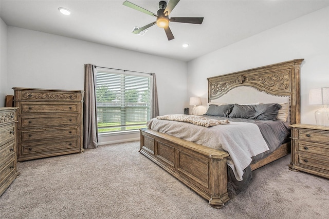 bedroom featuring a ceiling fan, recessed lighting, and light carpet