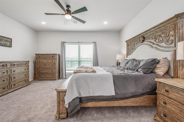bedroom featuring visible vents, a ceiling fan, recessed lighting, and light carpet