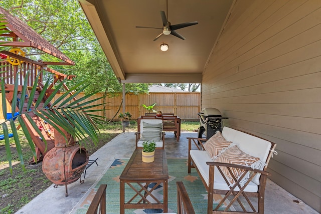 view of patio / terrace with fence, a ceiling fan, and an outdoor hangout area