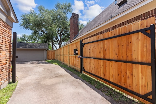 view of property exterior featuring fence, a chimney, roof with shingles, and a garage