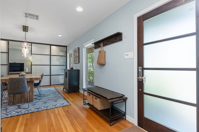 interior space with recessed lighting, baseboards, light wood-type flooring, and visible vents
