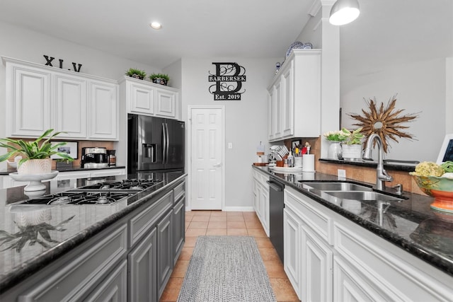 9614 Oconnor Ln, Missouri City, TX 77459 - kitchen featuring stovetop with downdraft, dishwasher, a sink, fridge with ice dispenser, and white cabinetry