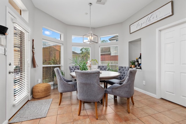 9614 Oconnor Ln, Missouri City, TX 77459 - dining room with an inviting chandelier, light tile patterned floors, baseboards, and visible vents