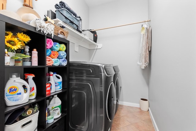 9614 Oconnor Ln, Missouri City, TX 77459 - clothes washing area featuring independent washer and dryer, light tile patterned flooring, laundry area, and baseboards