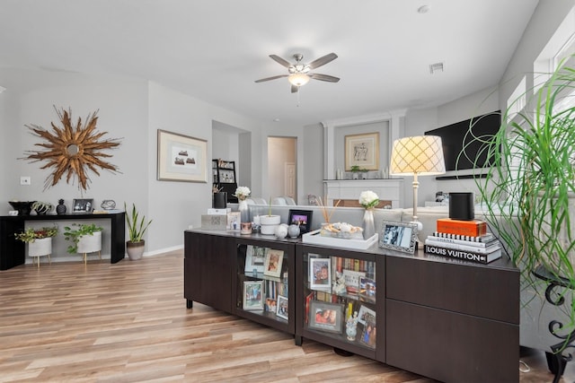 9614 Oconnor Ln, Missouri City, TX 77459 - interior space featuring a ceiling fan, baseboards, visible vents, and wood finished floors