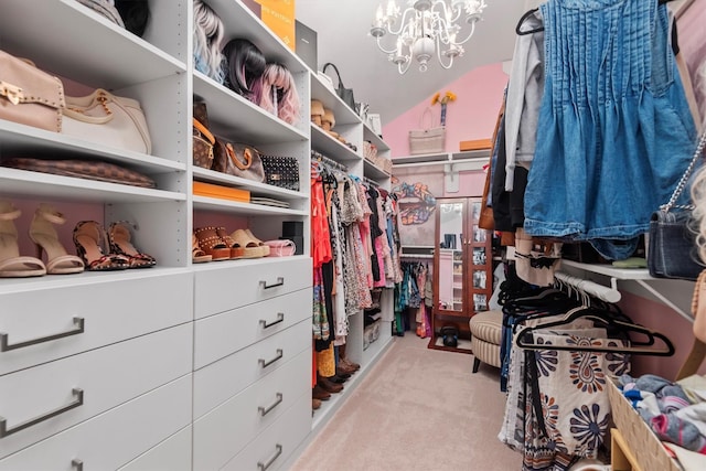 9614 Oconnor Ln, Missouri City, TX 77459 - walk in closet with carpet flooring, a chandelier, and lofted ceiling