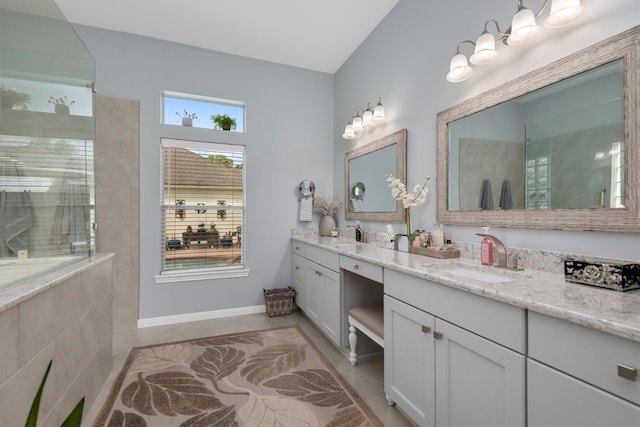 9614 Oconnor Ln, Missouri City, TX 77459 - full bath featuring double vanity, baseboards, a walk in shower, tile patterned floors, and a sink