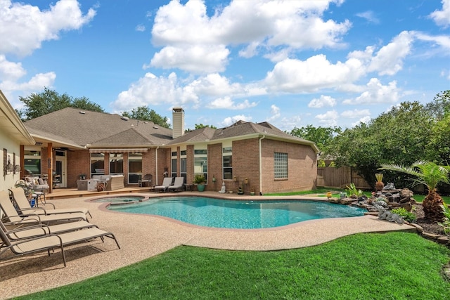 9614 Oconnor Ln, Missouri City, TX 77459 - view of pool featuring a patio, a lawn, fence, and a pool with connected hot tub