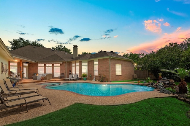 9614 Oconnor Ln, Missouri City, TX 77459 - view of swimming pool featuring a patio, a fenced backyard, and a pool with connected hot tub