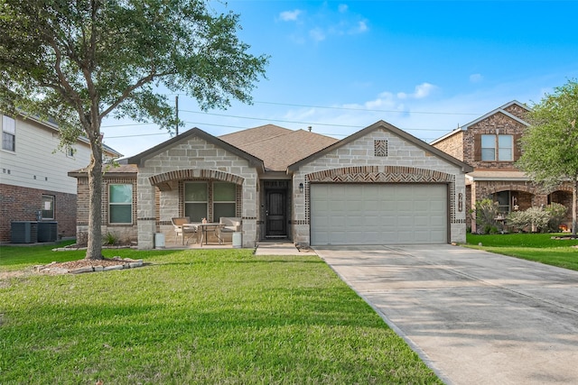 view of front facade featuring stone siding, driveway, a front yard, and a garage