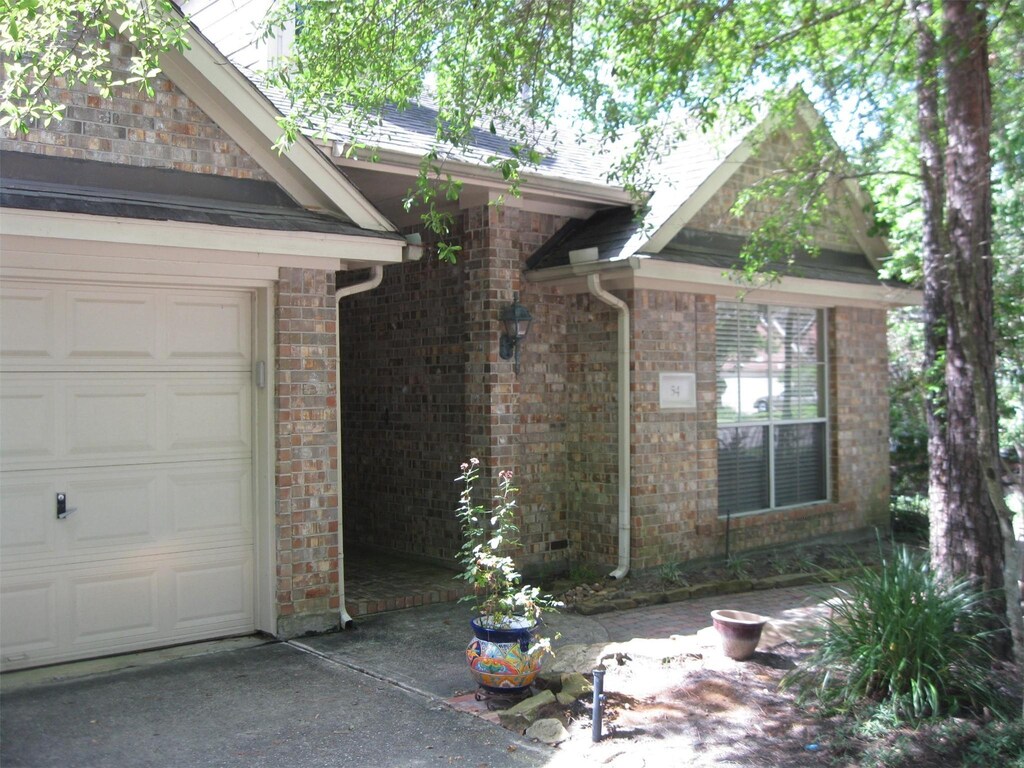 exterior space featuring brick siding