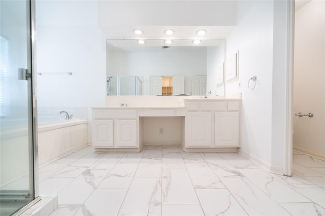 54 N Crossed Birch Pl, The Woodlands, TX 77381 - bathroom with a garden tub, double vanity, marble finish floor, a sink, and a stall shower