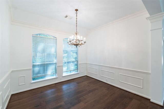 54 N Crossed Birch Pl, The Woodlands, TX 77381 - unfurnished dining area featuring crown molding, dark wood-type flooring, and a decorative wall