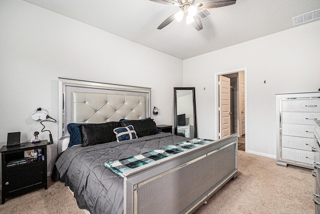 bedroom with baseboards, light carpet, a ceiling fan, and visible vents