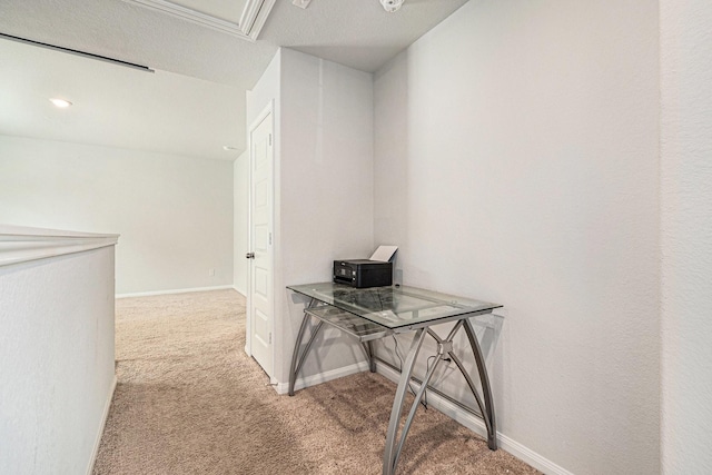 hallway with baseboards and carpet