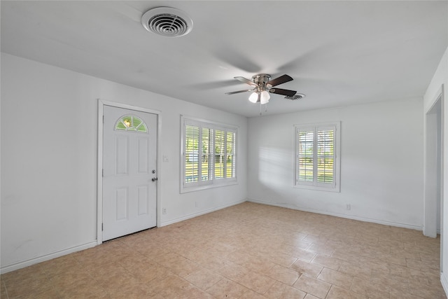 entrance foyer featuring a ceiling fan, baseboards, and visible vents