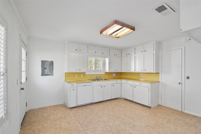 kitchen featuring visible vents, a sink, dishwasher, and light countertops