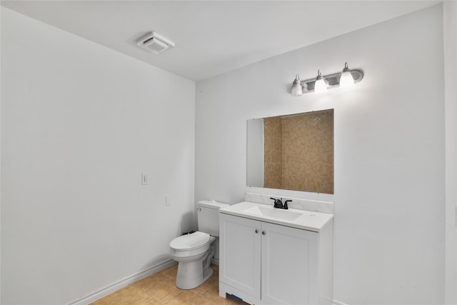 bathroom featuring visible vents, tile patterned flooring, vanity, toilet, and baseboards
