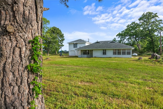 view of yard with a garage