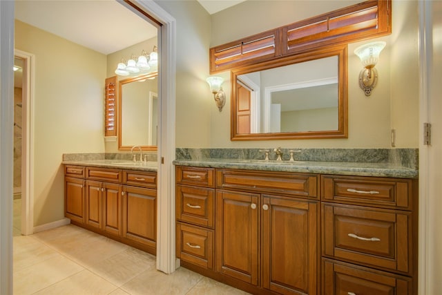 bathroom featuring tile patterned floors, two vanities, and a sink