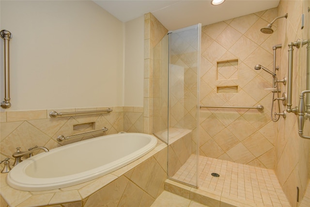 bathroom featuring a garden tub, recessed lighting, and tiled shower