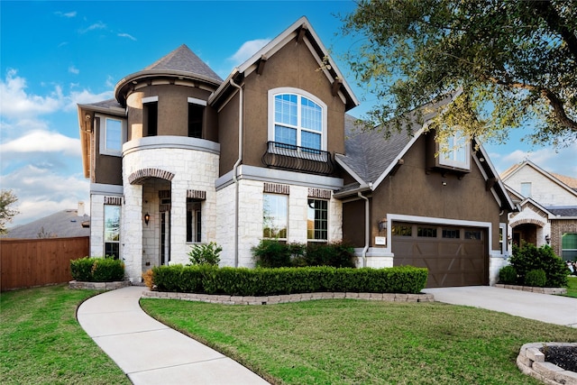 view of front of home featuring a front yard, fence, stone siding, and stucco siding