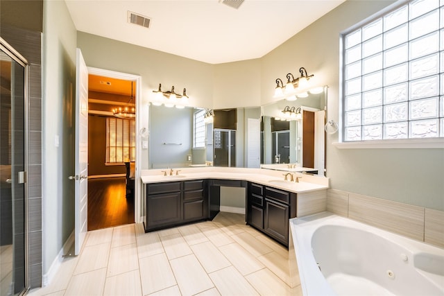 full bathroom with visible vents, tile patterned flooring, vanity, a whirlpool tub, and a shower stall