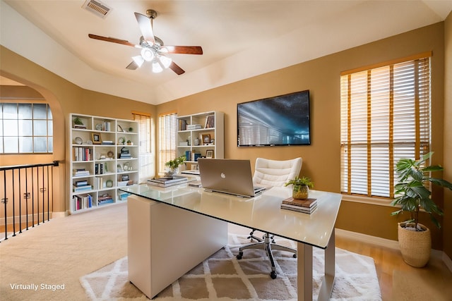 office with baseboards, ceiling fan, visible vents, and a wealth of natural light