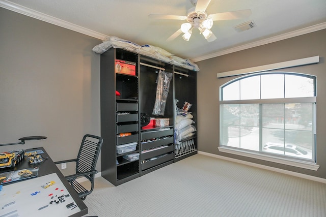 interior space featuring carpet flooring, crown molding, a ceiling fan, baseboards, and visible vents