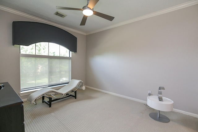 living area with carpet flooring, ceiling fan, visible vents, and ornamental molding