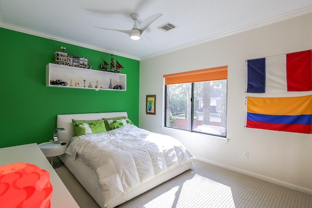 bedroom with ceiling fan, visible vents, baseboards, ornamental molding, and carpet flooring