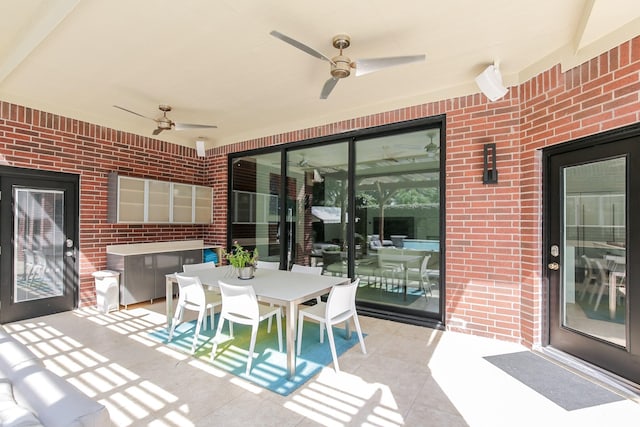 view of patio featuring a ceiling fan and outdoor dining space