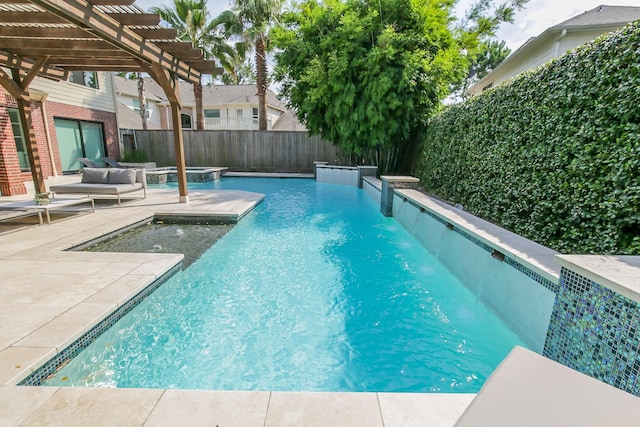 view of pool featuring a fenced backyard, a patio area, a pool with connected hot tub, and a pergola
