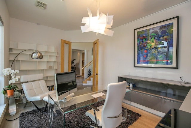 office space featuring visible vents and wood finished floors