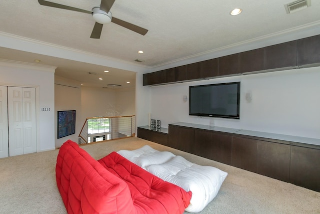 carpeted living area with a ceiling fan, visible vents, ornamental molding, and recessed lighting