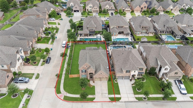 birds eye view of property with a residential view