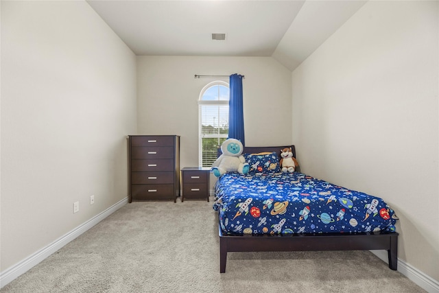 carpeted bedroom with baseboards, visible vents, and vaulted ceiling