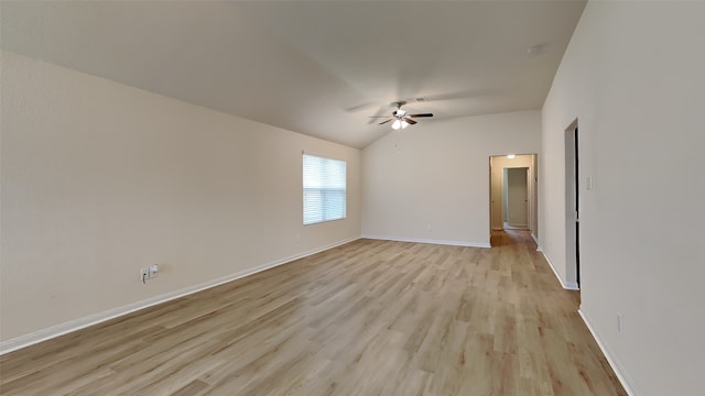 unfurnished room featuring light wood-style floors, baseboards, a ceiling fan, and lofted ceiling