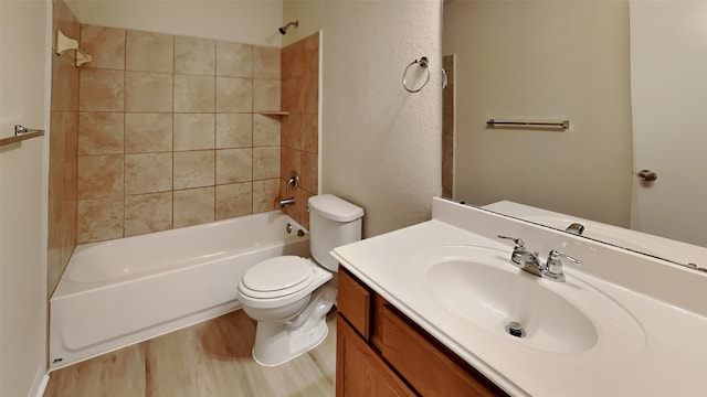 bathroom with vanity, shower / tub combination, wood finished floors, and toilet