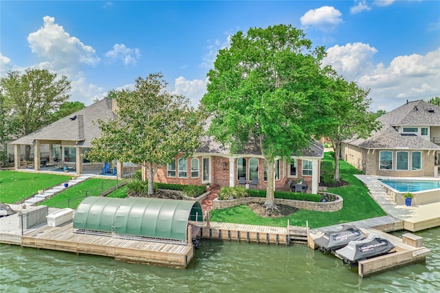 13625 Lakeside Place Dr, Willis, TX 77318 - back of house featuring a yard, a patio area, a water view, and brick siding