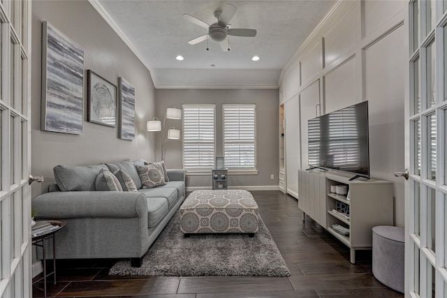 13625 Lakeside Place Dr, Willis, TX 77318 - living room featuring ornamental molding, baseboards, a ceiling fan, and dark wood finished floors