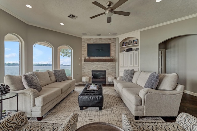 13625 Lakeside Place Dr, Willis, TX 77318 - living room with a ceiling fan, recessed lighting, baseboards, visible vents, and wood finished floors