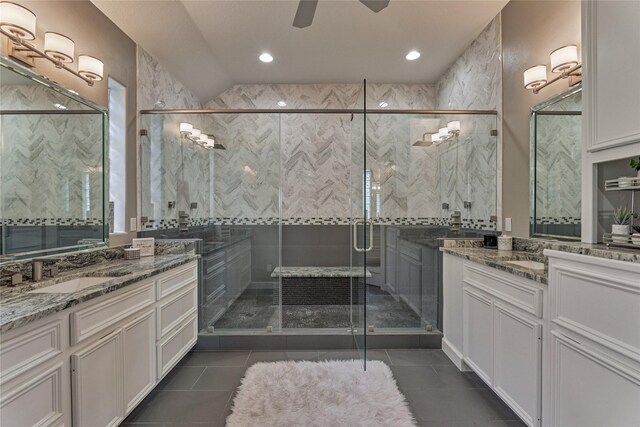 13625 Lakeside Place Dr, Willis, TX 77318 - full bath featuring a shower stall, tile patterned flooring, two vanities, and a sink